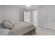 Bright bedroom with neutral colors, plush carpet, and access to other rooms at 408 Dairy Farm Dr, Hillsborough, NC 27278