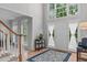 Bright foyer with hardwood floors, a large window, and a view of the front yard at 408 Dairy Farm Dr, Hillsborough, NC 27278