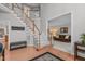 Elegant foyer featuring hardwood floors, a staircase, and an open view to the living room at 408 Dairy Farm Dr, Hillsborough, NC 27278