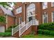 Impressive brick home with a grand entrance, manicured landscaping, and a classic design at 408 Dairy Farm Dr, Hillsborough, NC 27278
