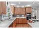 Modern kitchen featuring custom cabinets, stone countertops, and stainless steel appliances at 408 Dairy Farm Dr, Hillsborough, NC 27278