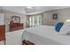 Spacious main bedroom with tray ceiling, dresser, and sun-filled windows at 408 Dairy Farm Dr, Hillsborough, NC 27278