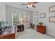Bright home office featuring a desk, a filing cabinet, and large windows offering natural light at 408 Dairy Farm Dr, Hillsborough, NC 27278
