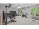 This large workout room has lots of natural light and plenty of space for all kinds of equipment at 408 Dairy Farm Dr, Hillsborough, NC 27278