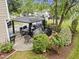 Outdoor living space with a gazebo, patio, dining area, and lush landscaping at 4104 Panther Creek Pkwy, Durham, NC 27704
