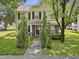 Charming two-story home features a well-manicured lawn and a welcoming front porch with brick and stone accents at 4104 Panther Creek Pkwy, Durham, NC 27704