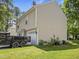 Two-story home featuring neutral siding, attached garage, and well-maintained landscaping at 4104 Panther Creek Pkwy, Durham, NC 27704