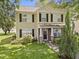 Charming two-story home features a well-manicured lawn and a welcoming front porch with brick and stone accents at 4104 Panther Creek Pkwy, Durham, NC 27704