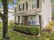 Charming two-story home features a well-manicured lawn and a welcoming front porch with brick and stone accents at 4104 Panther Creek Pkwy, Durham, NC 27704