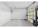 A clean, empty, and well-lit two car garage with ample space for parking and storage at 4104 Panther Creek Pkwy, Durham, NC 27704