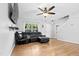 Spacious living room boasts hardwood floors and a comfortable seating area, and a stairway access to upper floors at 4104 Panther Creek Pkwy, Durham, NC 27704