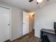 Bedroom with wood-look flooring, white walls, and plenty of closet space at 4125 Brushy Ridge Dr, Holly Springs, NC 27540