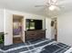Comfortable bedroom featuring wood-look floors and ensuite bathroom at 4125 Brushy Ridge Dr, Holly Springs, NC 27540