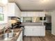 Bright, modern kitchen with stainless steel sink and modern appliances at 4125 Brushy Ridge Dr, Holly Springs, NC 27540