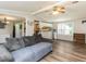Bright living space showing vinyl floors, open layout, and ceiling fan at 4125 Brushy Ridge Dr, Holly Springs, NC 27540