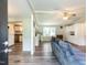 Open-concept living area with durable vinyl flooring, ceiling fan, and neutral colors at 4125 Brushy Ridge Dr, Holly Springs, NC 27540