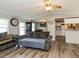 Bright living space with vinyl floors, open layout, and ceiling fan at 4125 Brushy Ridge Dr, Holly Springs, NC 27540
