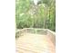 Private backyard deck overlooking a lush, wooded landscape at 4206 Camden Woods Ct, Raleigh, NC 27612