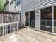 Outdoor wooden deck area with access to the house through sliding glass doors at 4206 Camden Woods Ct, Raleigh, NC 27612