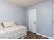 Clean bedroom featuring a daybed with decorative bedding and a bright, minimalist design at 4206 Camden Woods Ct, Raleigh, NC 27612