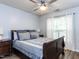 Bedroom with a ceiling fan, and lots of natural light from the large windows at 4206 Camden Woods Ct, Raleigh, NC 27612
