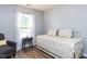 Cozy bedroom with a daybed, comfortable seating, and a window providing natural light at 4206 Camden Woods Ct, Raleigh, NC 27612