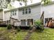 The home has a rear exterior view with multiple decks and lush landscaping at 4206 Camden Woods Ct, Raleigh, NC 27612