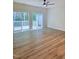 Bright living room with wood floors and sliding doors to a deck at 4206 Camden Woods Ct, Raleigh, NC 27612