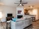 Cozy living room boasts a fireplace and flows into a modern kitchen area at 4206 Camden Woods Ct, Raleigh, NC 27612