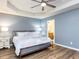 The main bedroom features a tray ceiling and an ensuite bathroom at 4206 Camden Woods Ct, Raleigh, NC 27612