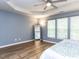 Main bedroom showcasing ample space, natural light, and a full length mirror at 4206 Camden Woods Ct, Raleigh, NC 27612