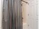 Shower with a gray shower curtain at 4206 Camden Woods Ct, Raleigh, NC 27612