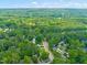 Aerial view of a neighborhood with mature trees and well-maintained homes at 4500 Lancashire Dr, Raleigh, NC 27613