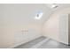 Upstairs bonus room with skylight and built-in storage at 4500 Lancashire Dr, Raleigh, NC 27613