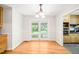 Well-lit dining room with hardwood floors and view of outdoor scenery at 4500 Lancashire Dr, Raleigh, NC 27613