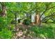 Charming front yard with an archway, landscaping, and an inviting entrance at 4500 Lancashire Dr, Raleigh, NC 27613