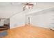 Bright and airy living room featuring hardwood floors, staircase and vaulted ceilings at 4500 Lancashire Dr, Raleigh, NC 27613