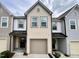 Charming two-story townhouse with neutral siding, attached garage, and covered front porch at 4716 Princess Lita Way, Raleigh, NC 27610