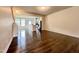 Open-concept living space with dining area and kitchen featuring hardwood floors and recessed lighting at 4716 Princess Lita Way, Raleigh, NC 27610
