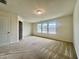 Large main bedroom features plush carpeting and multiple windows providing ample natural light at 4716 Princess Lita Way, Raleigh, NC 27610
