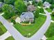 High-angle aerial view displays well-maintained property with verdant surroundings in a quiet neighborhood at 4953 Mashpee Ln, Apex, NC 27539