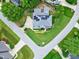 Overhead aerial view highlights the home's layout, surrounding greenery, and solar panels on the roof at 4953 Mashpee Ln, Apex, NC 27539