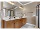 Bright bathroom with double vanity, soaking tub, walk in shower and tile floors at 4953 Mashpee Ln, Apex, NC 27539