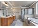 Luxurious bathroom with double vanity, soaking tub, and frameless glass shower at 4953 Mashpee Ln, Apex, NC 27539