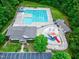 An aerial photograph showing an outdoor swimming pool with a slide and play area at 4953 Mashpee Ln, Apex, NC 27539