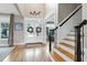 Grand foyer with soaring ceilings, hardwood floors, and staircase at 4953 Mashpee Ln, Apex, NC 27539