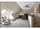 Open-concept home theater with skylights, rocking chairs, and recliners for ultimate comfort at 4953 Mashpee Ln, Apex, NC 27539
