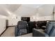 Comfortable home theater seating with a large screen and recessed lighting for an immersive experience at 4953 Mashpee Ln, Apex, NC 27539