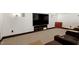 A custom home theater featuring reclining chairs, a large TV screen, and accent lighting at 4953 Mashpee Ln, Apex, NC 27539