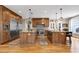 Gourmet kitchen features two islands, stainless appliances, and ample cabinet space at 4953 Mashpee Ln, Apex, NC 27539
